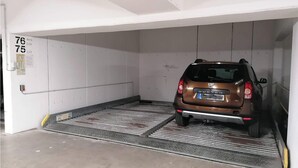 A car parked in a garage with a ramp leading to the entrance. - MB-2. 28 - Ocean View Apt. MB-228th (Kühlungsborn)