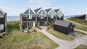 A modern two-story house with a large balcony, a small garden, and a view of the sea. - 3 bedroom gorgeous home in Assens (Assens)