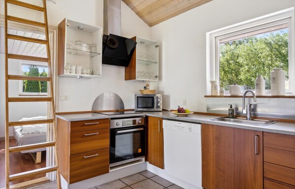 Fridge, stovetop, dishwasher, coffee/tea maker