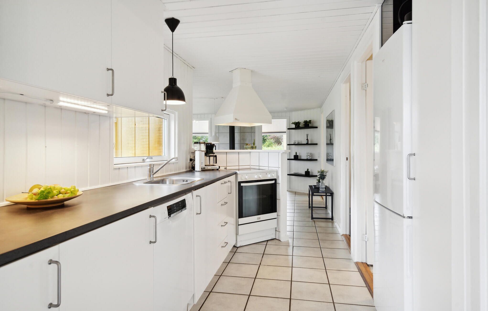 Fridge, stovetop, dishwasher, coffee/tea maker