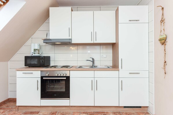 Fridge, coffee/tea maker, electric kettle, toaster