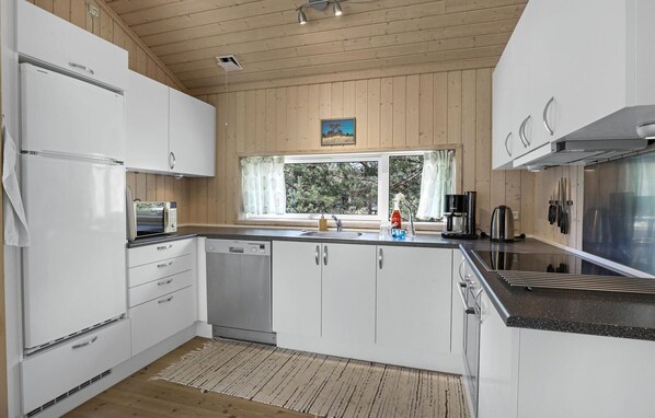 Fridge, stovetop, dishwasher, coffee/tea maker