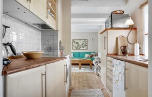 Fridge, stovetop, dishwasher, coffee/tea maker