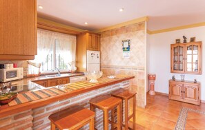 Fridge, stovetop, dishwasher, coffee/tea maker