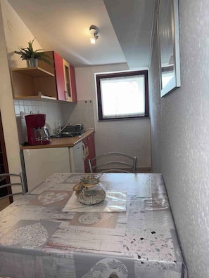 Fridge, stovetop, coffee/tea maker, cookware/dishes/utensils