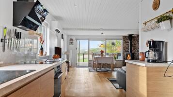 Fridge, stovetop, dishwasher, coffee/tea maker