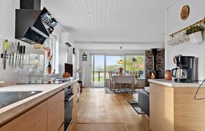 Fridge, stovetop, dishwasher, coffee/tea maker