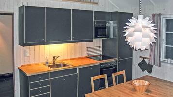 Fridge, stovetop, dishwasher, coffee/tea maker