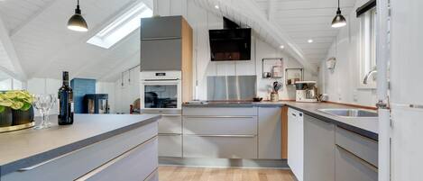 Fridge, stovetop, dishwasher, coffee/tea maker