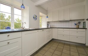 Fridge, stovetop, dishwasher, coffee/tea maker