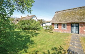 Escape to a serene cottage surrounded by lush gardens and a tranquil atmosphere.