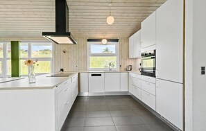 Fridge, stovetop, dishwasher, coffee/tea maker