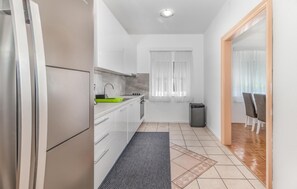 Fridge, stovetop, dishwasher, coffee/tea maker