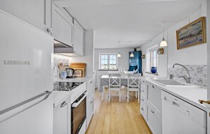 Fridge, stovetop, dishwasher, coffee/tea maker