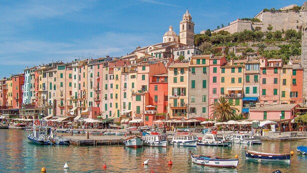 A coastal town with colorful buildings, a prominent church, and a marina with boats. - Cozy home in Porto Venere SP with WiFi (Porto Venere SP)