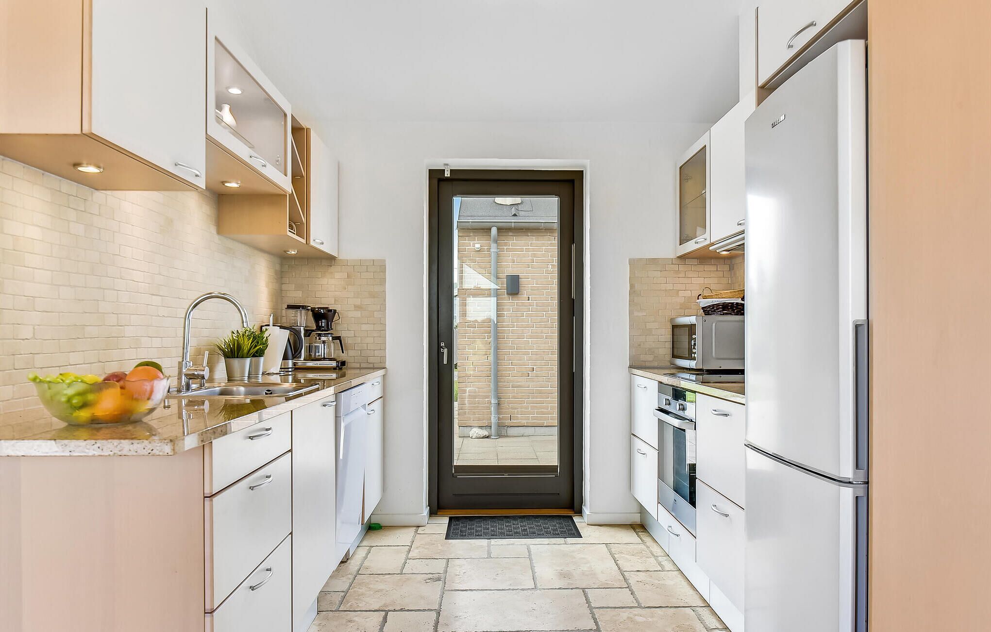 Fridge, stovetop, dishwasher, coffee/tea maker