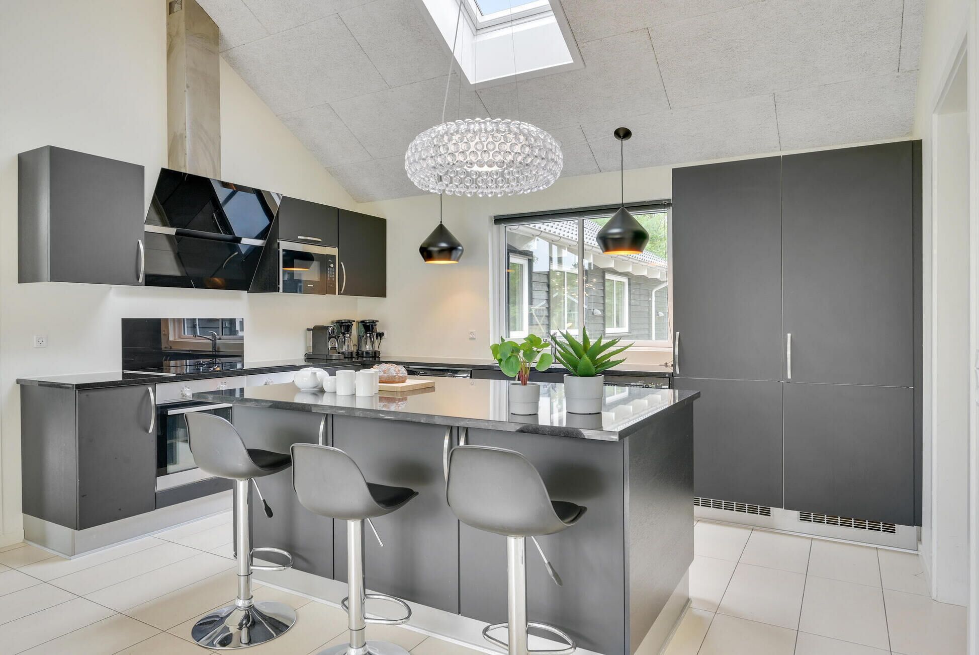 Fridge, stovetop, dishwasher, coffee/tea maker