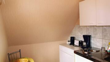 Fridge, coffee/tea maker, electric kettle, toaster