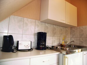 Fridge, coffee/tea maker, electric kettle, toaster