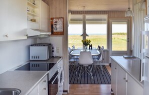 Fridge, stovetop, dishwasher, coffee/tea maker