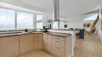 Fridge, stovetop, dishwasher, coffee/tea maker