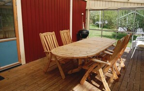 Enjoy outdoor dining and socializing on this deck with a barbecue grill and seating for four.
