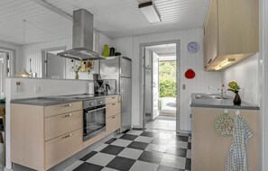 Fridge, stovetop, dishwasher, coffee/tea maker