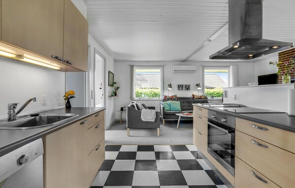 Fridge, stovetop, dishwasher, coffee/tea maker