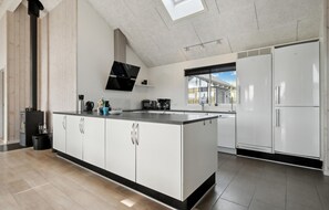 Fridge, stovetop, dishwasher, coffee/tea maker