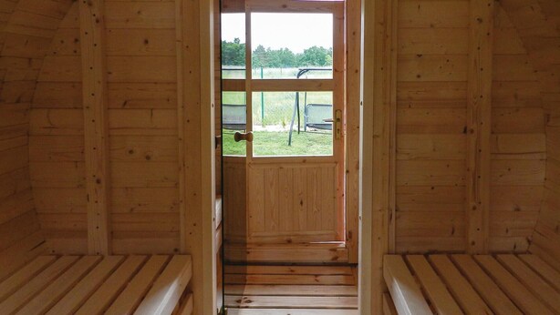 A wooden interior with a view through a door to an outdoor area. - 2 bedroom lovely home in Glowczyce (Glowczyce)