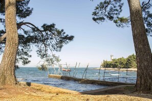 Enjoy breathtaking views of the sea and surrounding landscape from this picturesque beachside location.