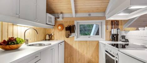 Fridge, stovetop, dishwasher, coffee/tea maker