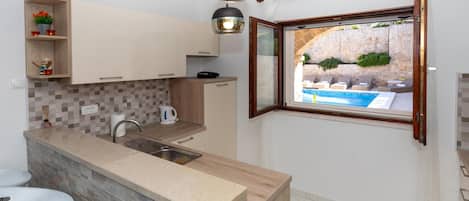 Fridge, microwave, stovetop, coffee/tea maker