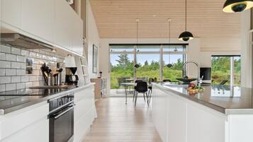 Fridge, stovetop, dishwasher, coffee/tea maker