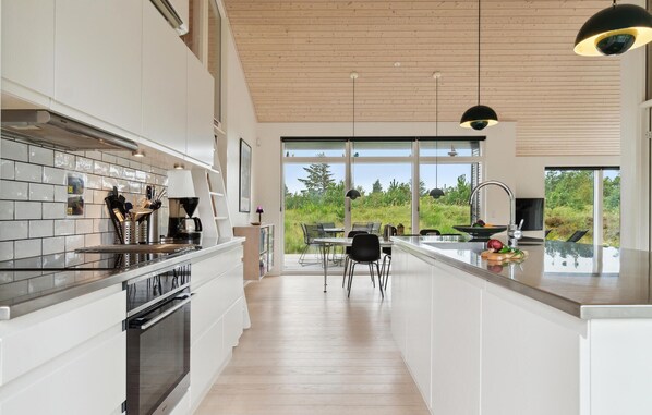 Enjoy cooking in this well-equipped kitchen with oven, stovetop, and ample counter space.