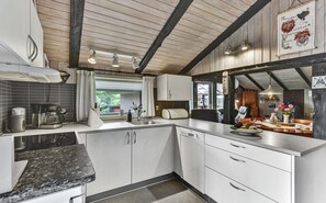 Fridge, stovetop, dishwasher, coffee/tea maker