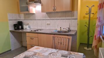 Fridge, coffee/tea maker, electric kettle, toaster