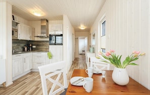 Fridge, stovetop, dishwasher, coffee/tea maker