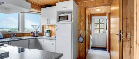 Fridge, stovetop, dishwasher, coffee/tea maker