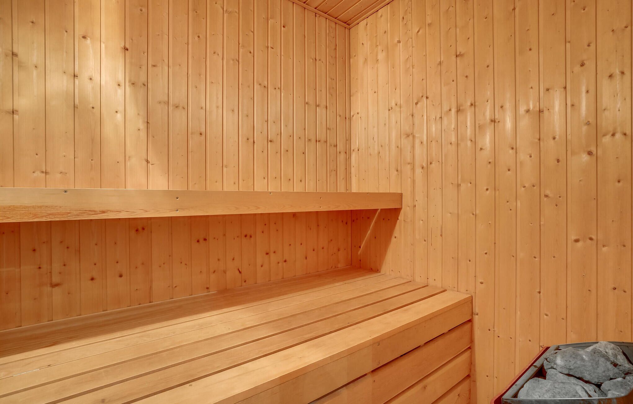 A sauna with wooden walls and benches.