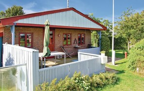 Sit on the porch and enjoy the surroundings from this charming single-story home.