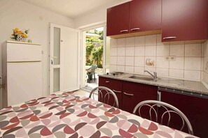 Fridge, stovetop, coffee/tea maker, cookware/dishes/utensils