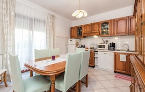 Fridge, stovetop, dishwasher, coffee/tea maker