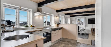 Fridge, stovetop, dishwasher, coffee/tea maker