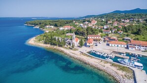 An aerial view of a coastal town with a marina, houses, and a church. - 1 bedroom beautiful home in Zdrelac (Zdrelac)