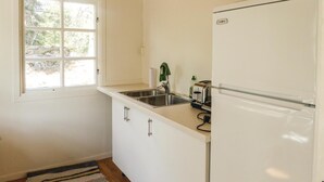 A small kitchen with a window, a sink, a refrigerator, and a toaster. - Beautiful home in Trosa (Trosa)