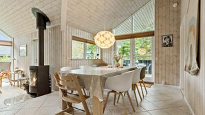 A spacious kitchen with a large island, wooden cabinets, and a modern pendant light. - Beautiful home in Ebeltoft with WiFi (Ebeltoft)