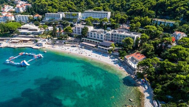 An aerial view of a coastal area with a beach, buildings, and a water park. - Awesome apartment in Dubrovnik with WiFi (Dubrovnik)