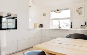 Fridge, stovetop, dishwasher, coffee/tea maker
