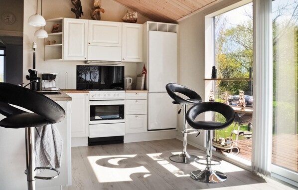 Fridge, stovetop, dishwasher, coffee/tea maker